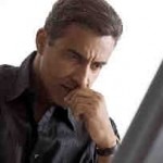 Mann hinter Rechner (Microsoft Clip Art)